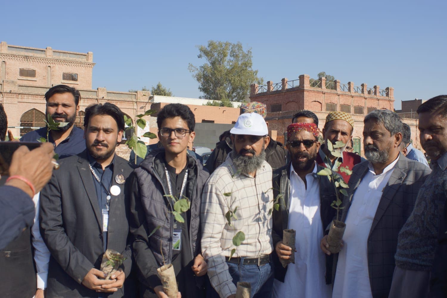 Participants standing with the environmental installation in progress.